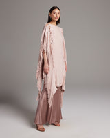 Model wearing a pink Lace Fringe Manta over a satin dress