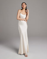Model wearing a bridal liquid slipdress in ivory, showcasing its elegant design.