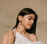 Model wearing Millapani Barroca Earrings, showcasing their design and elegance.