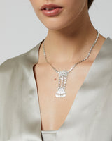 Model wearing the Necklace de Jardin, a handmade sterling silver piece with ceremonial symbolism.