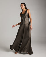 Model wearing a silk palazzo pants and tank top in forest taupe