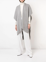 Model wearing a grey solid alpaca duster over a white outfit