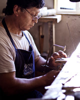 Silversmith Ceferino Cheuquecoy crafting a ceremonial pin