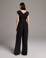 Back view of a black V Neck Jumpsuit with a belt