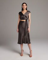 Model wearing a Bias Midi Skirt in Silk Charmeuse with a matching top, showcasing a relaxed fit and mid-calf length.