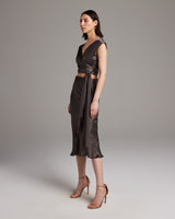 Model wearing a Bias Midi Skirt in Silk Charmeuse with a matching top, showcasing the outfit's fit and style.