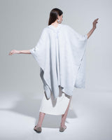 Model wearing a light blue Copihue Duster, back view