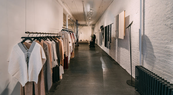 Interior view of VOZ Sanctuary in SoHo, showcasing clothing displays and gallery space