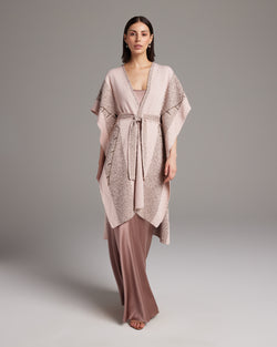 Model wearing a pink and beige Zig Zag Caftan with a tie belt